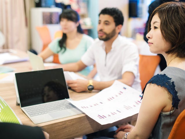 woman learning japanese with her peers
