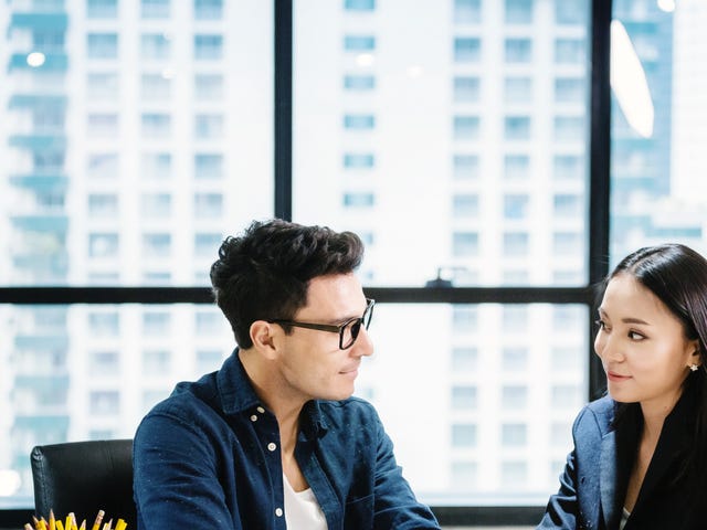 colleagues taking their intensive language classes in the office