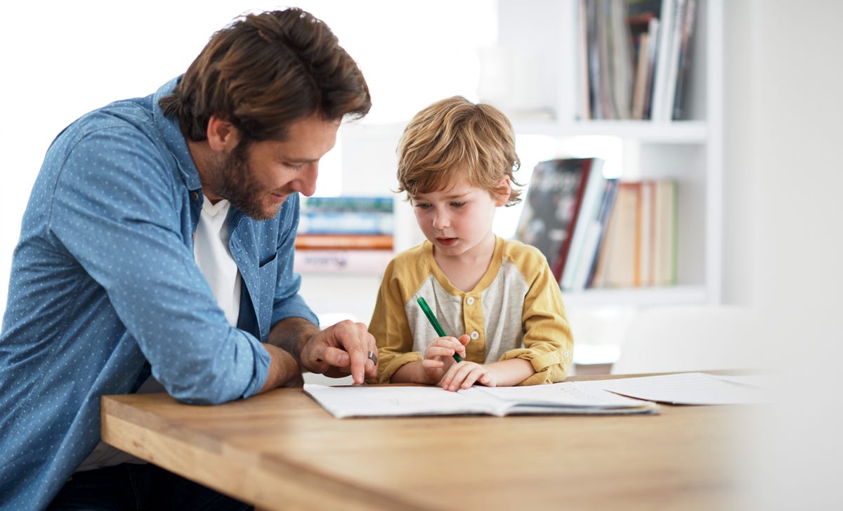 kid attending a private language course with his father