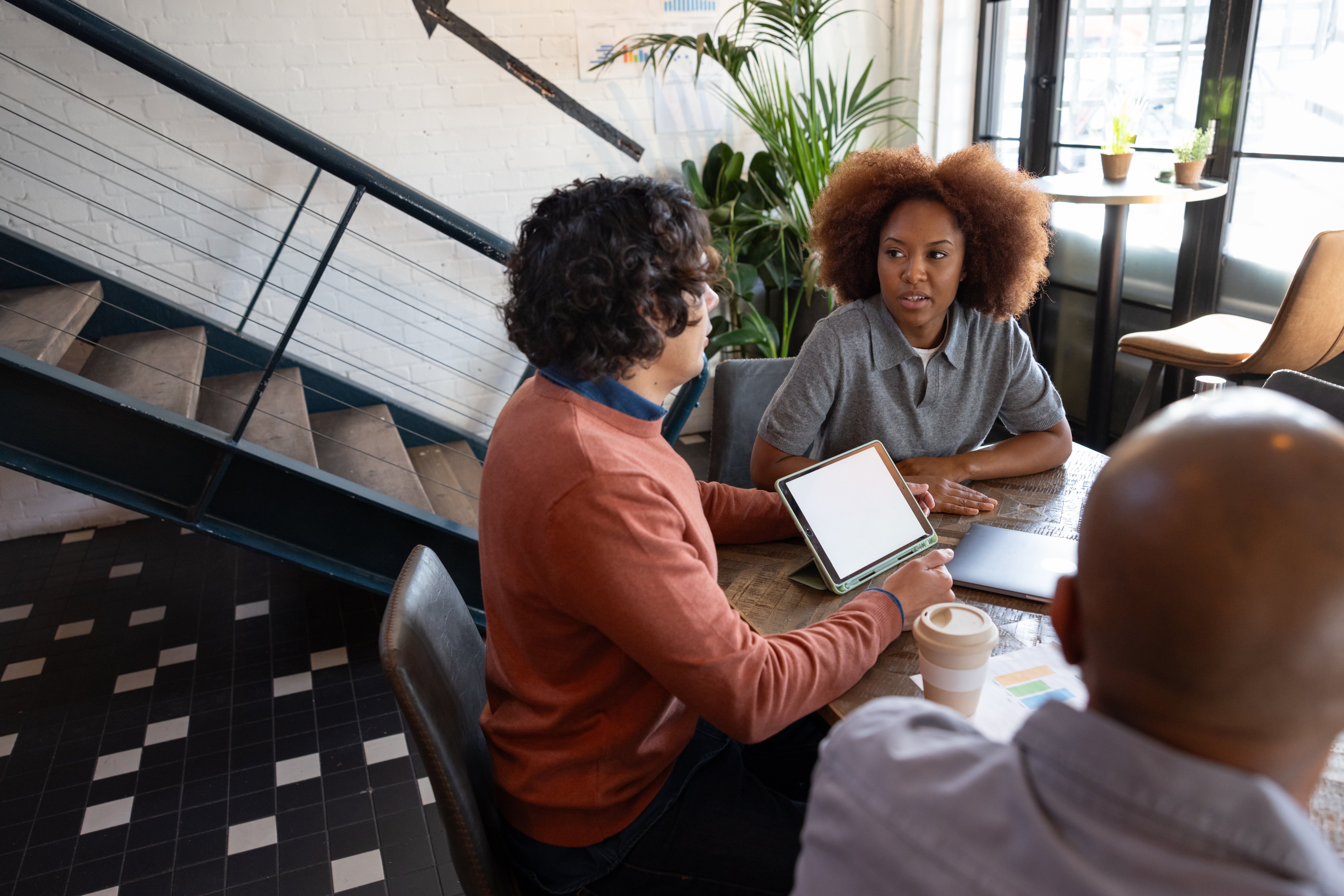 Woman attending a French class in Calgary with Berlitz and listening to her instructor