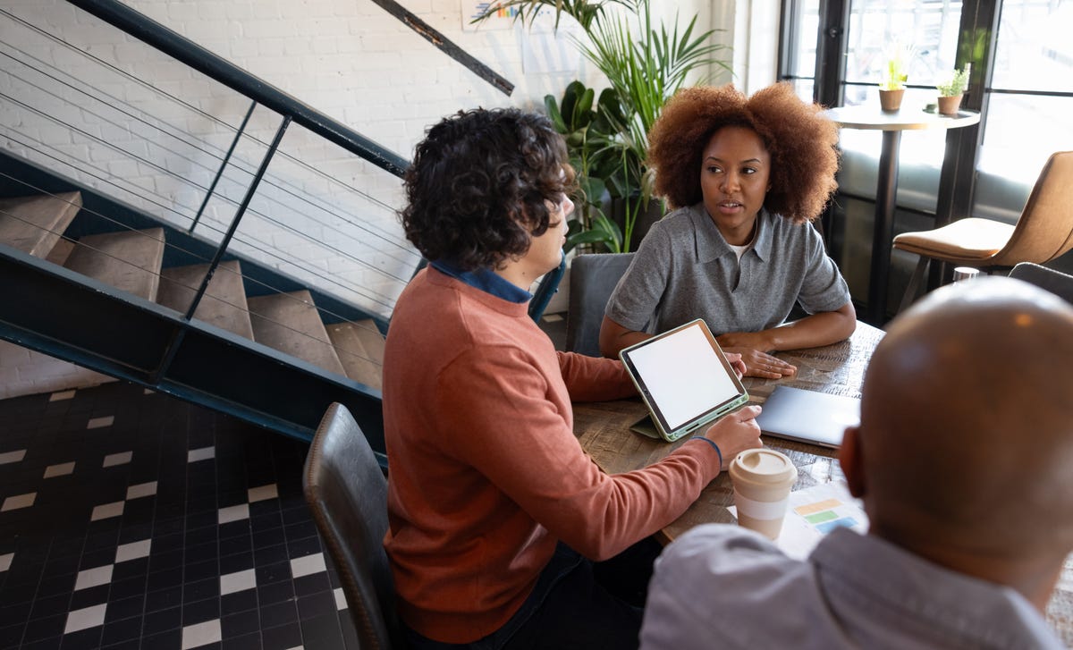 Woman attending a French class in Calgary with Berlitz and listening to her instructor