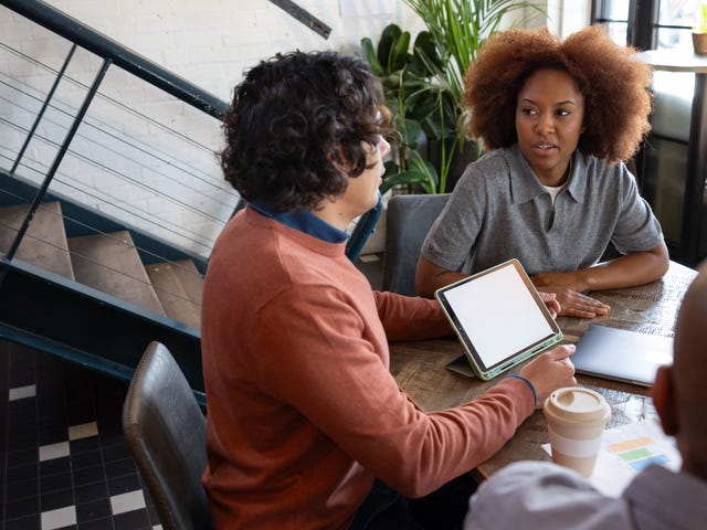 Woman attending a French class in Calgary with Berlitz and listening to her instructor