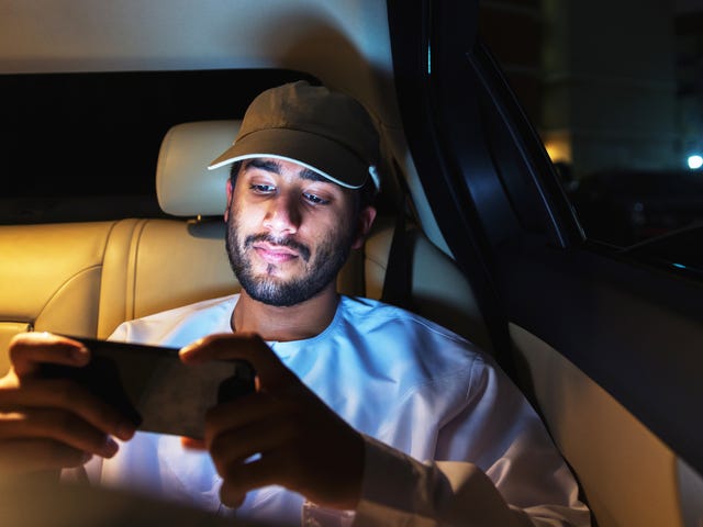 man attending his self-paced language studies online on his phone