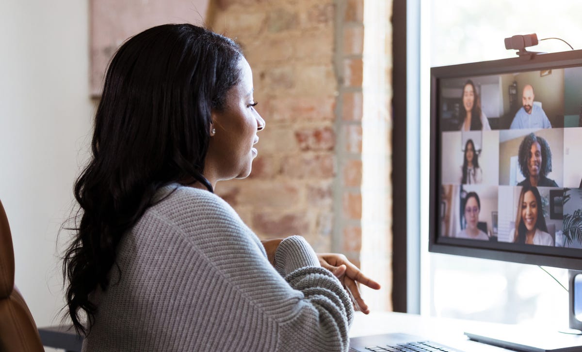woman joining her online group classes from home