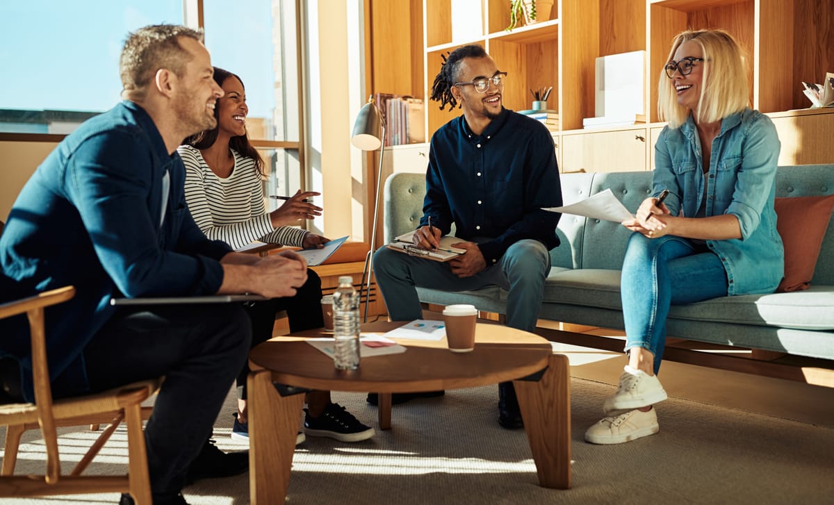 Coworkers attending a meeting in Spanish after learning the langauge with Berlitz Montreal's Spanish courses