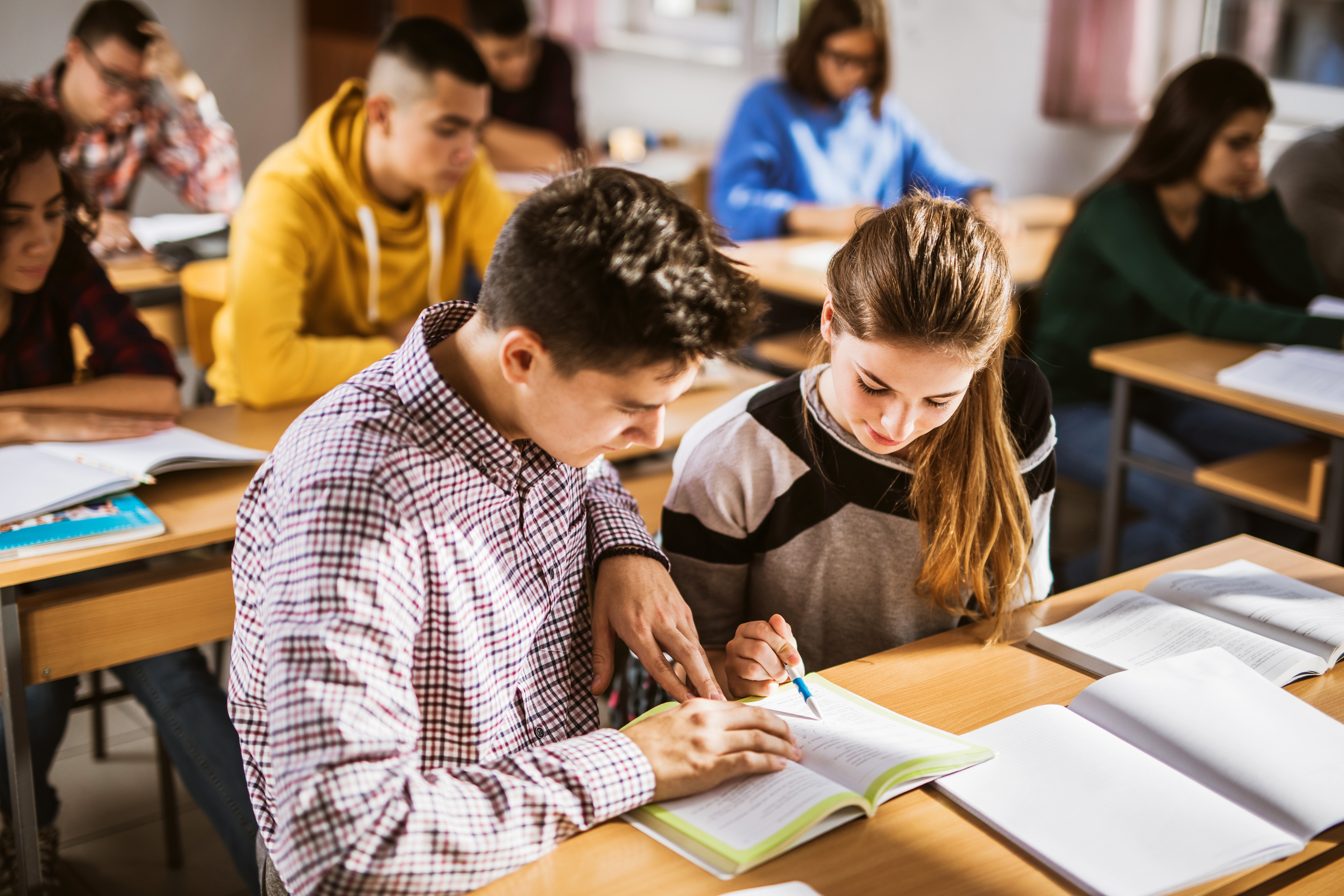 teens learning french in a group