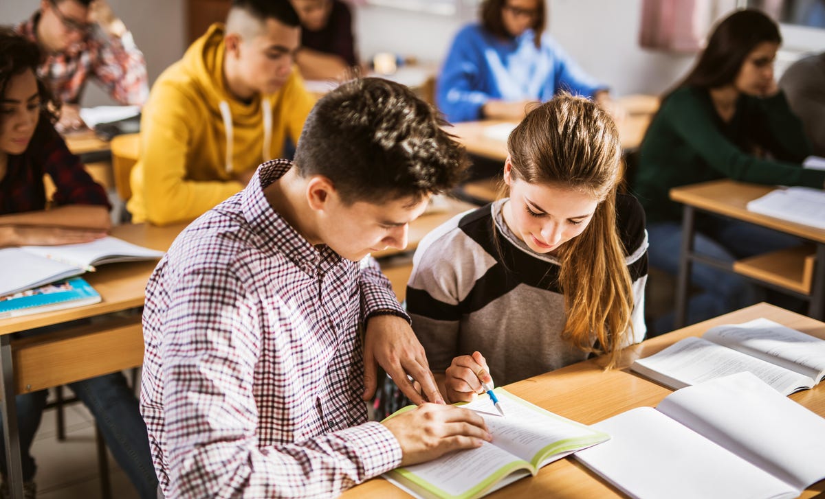 teens learning french in a group