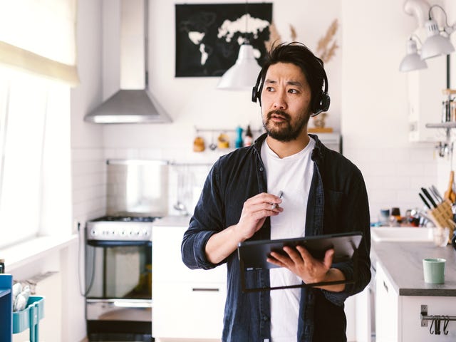 man attending online private classes on his tablet