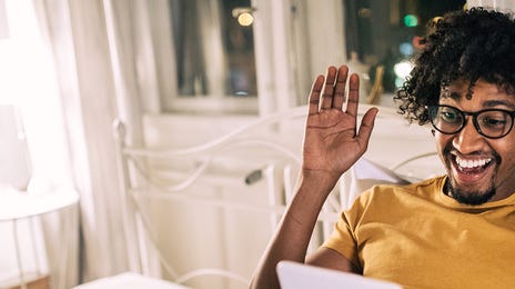 man learning spanish online from home