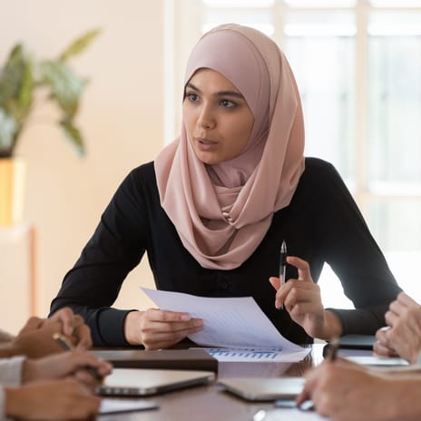 A Global Mobility Manager during a meeting with her employees