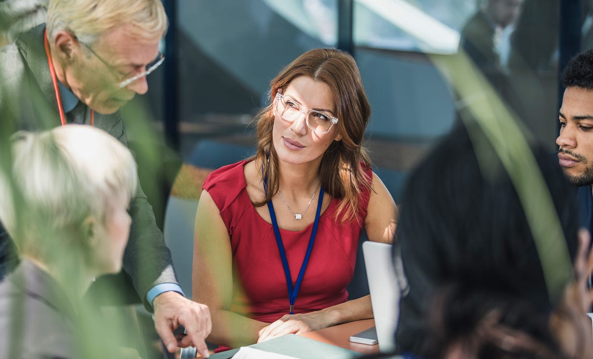 colleagues engaging in a conversation in korean