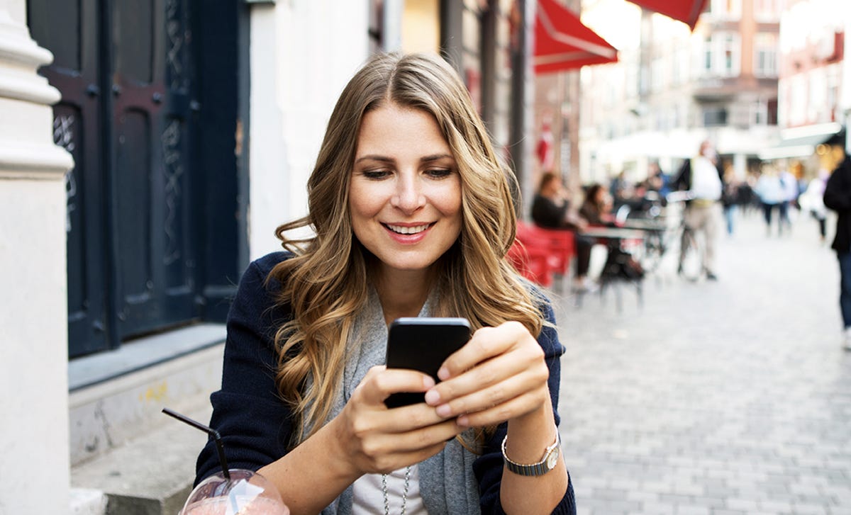 woman joining an online language class from her phone