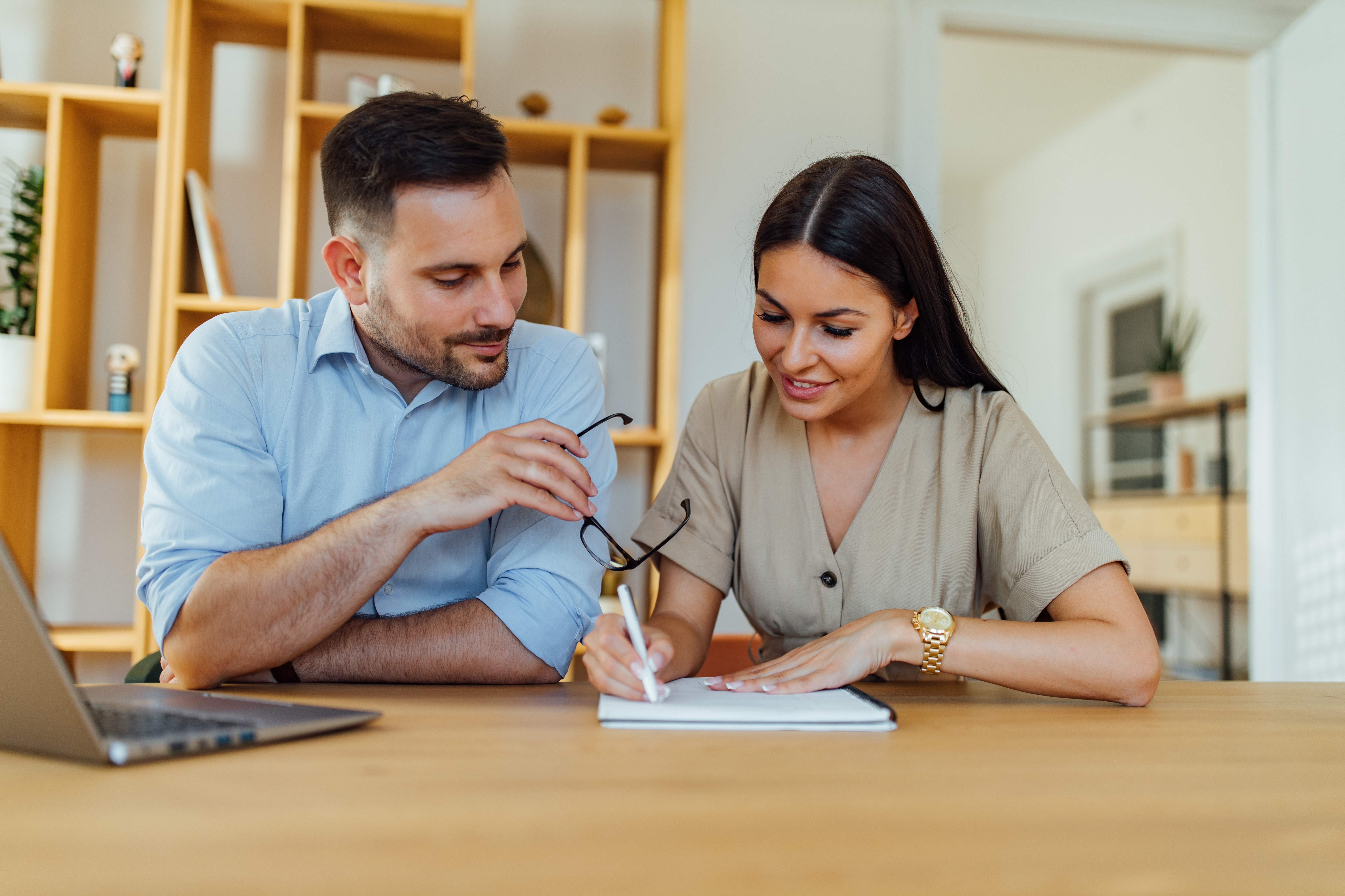 Woman attending an intensive French lesson in Toronto with Berlitz and writing in her notebook