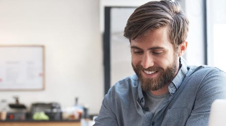 man learning mandarin online from home