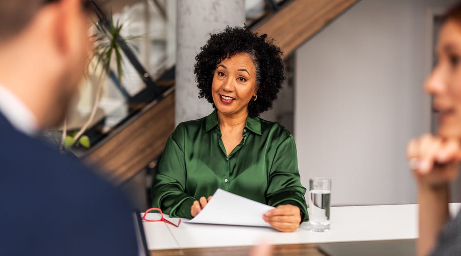 Woman with papers learning about subsidized language courses in Canada