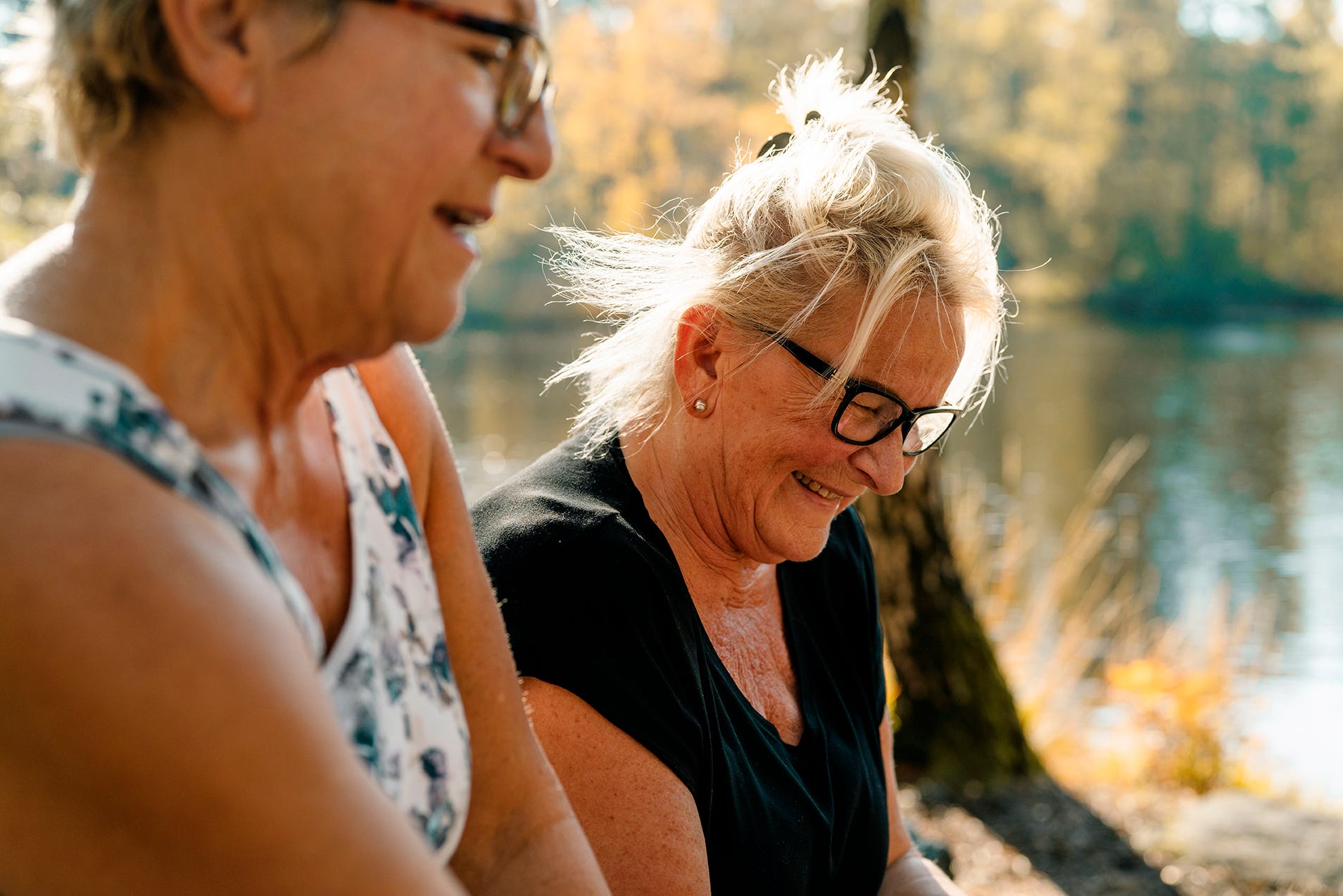 Two elderly woman practicing the French numbers together