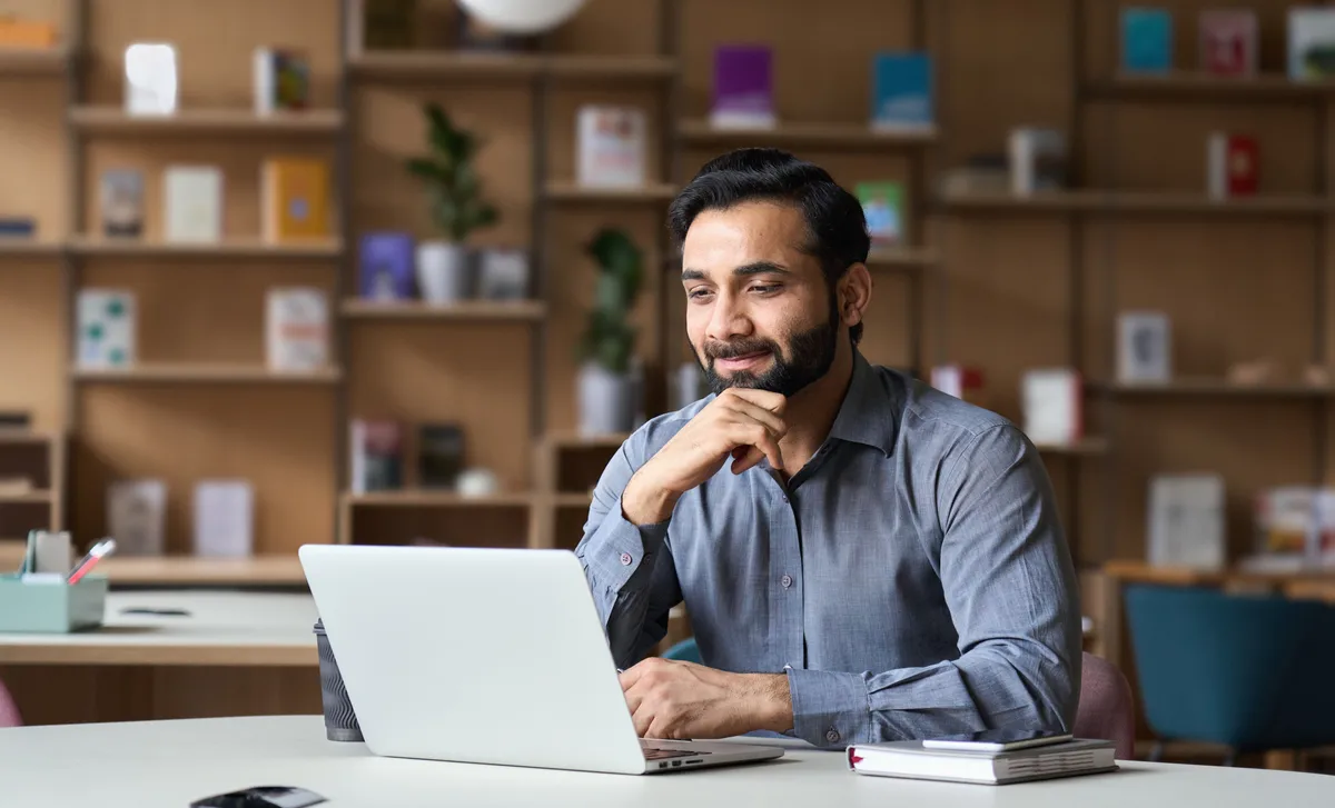 Man working for the government using Cyberteachers to learn a language online.
