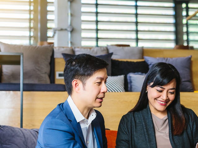 man and woman discussing tasks for their intensive language classes