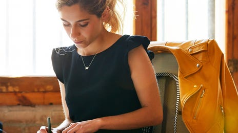 woman taking a language testing and assessment test online at home