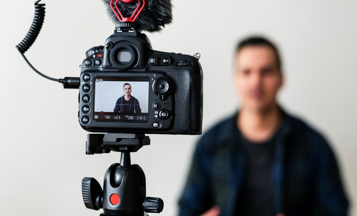 Berlitz instructor filming himself for a mini video lesson