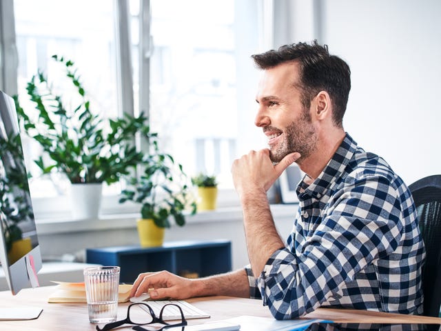 man joining his online private classes on his computer from home