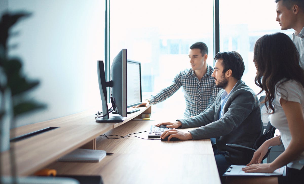 colleagues taking online language classes from the office