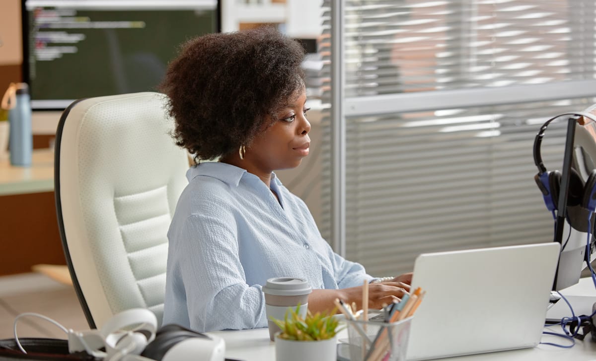 Woman in her office looking at Business English classes at Berlitz Edmonton