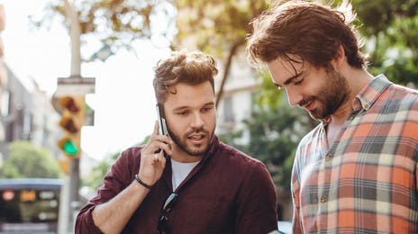 tourists holding a map and talking abroad