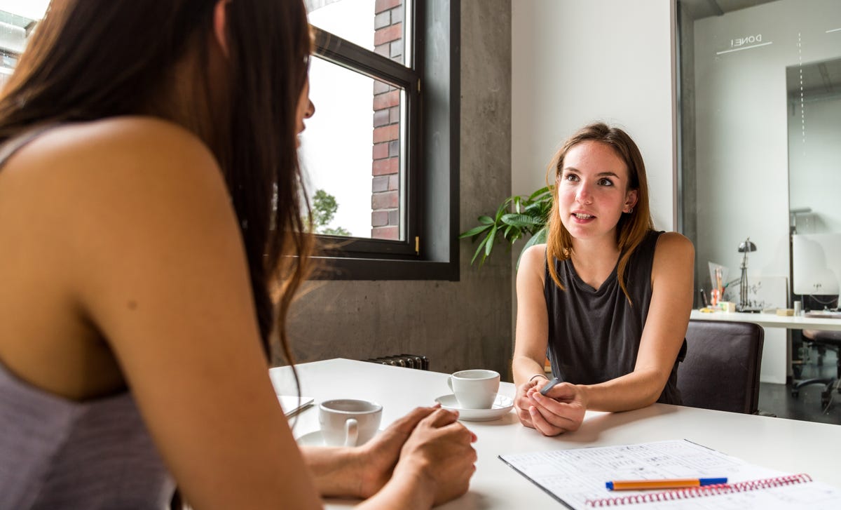Woman talking to her instructor during an intensive French lesson in Vancouver with Berlitz