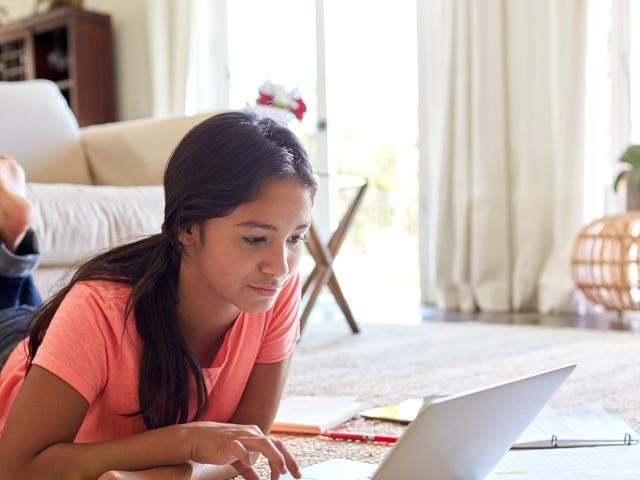 girl taking an online language course on her notebook