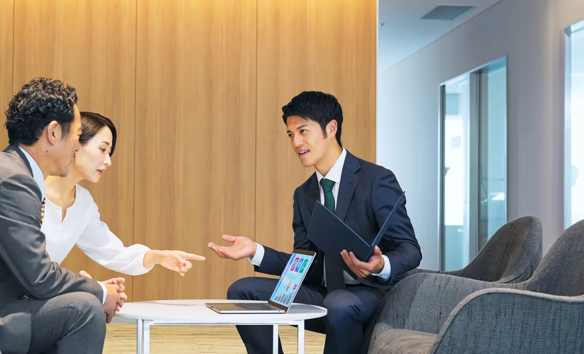 Businessman talking to his clients after attending Berlitz Canada's Banking & Financial Services Language Training