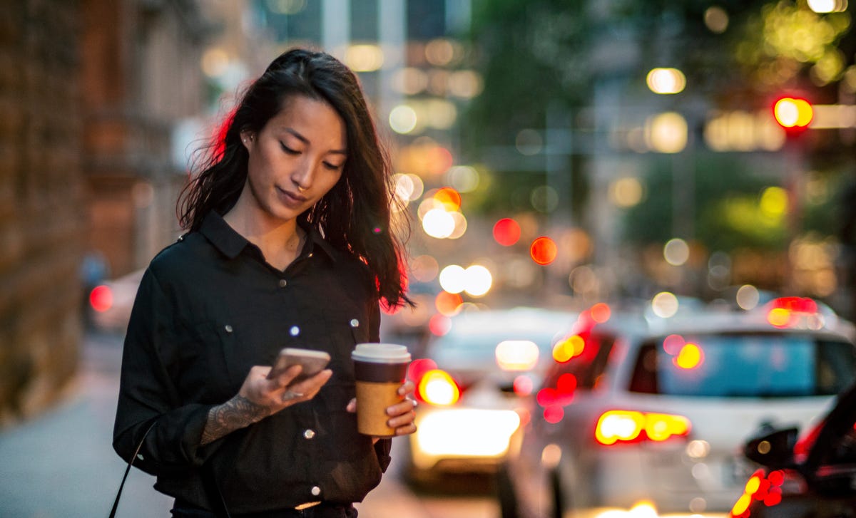 woman attending her self-paced studies online from her phone
