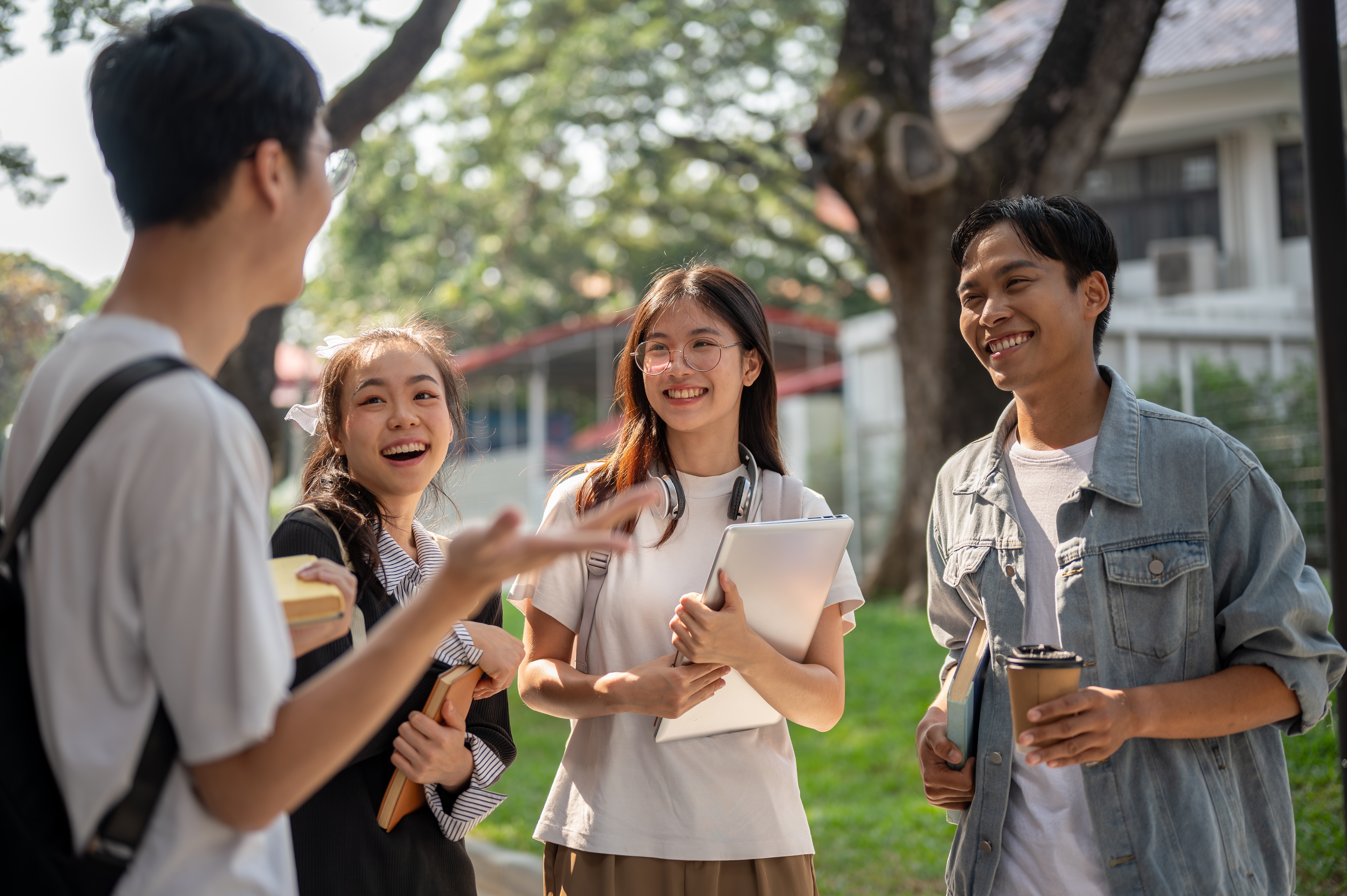 Group of teenagers chatting outside before their English lesson for kids and teens with Berlitz Canada
