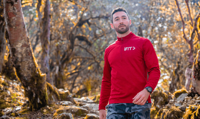 Casey Gilbert walks in a Bhutanese forest.