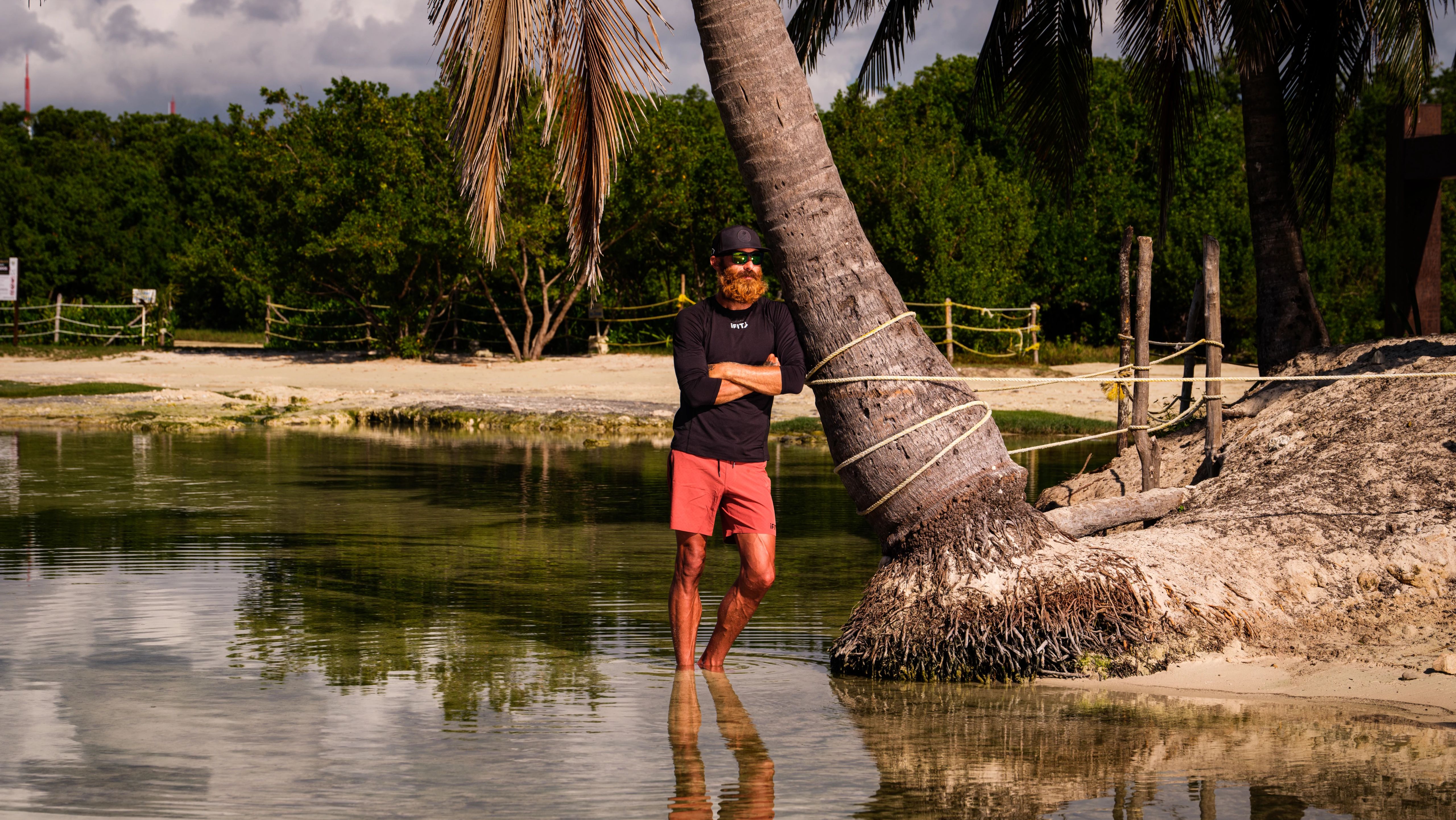 iFIT Trainer Tommy Rivs Puzey pauses along a quiet lagoon in Mexico during his low-key Road to Recovery walking series.