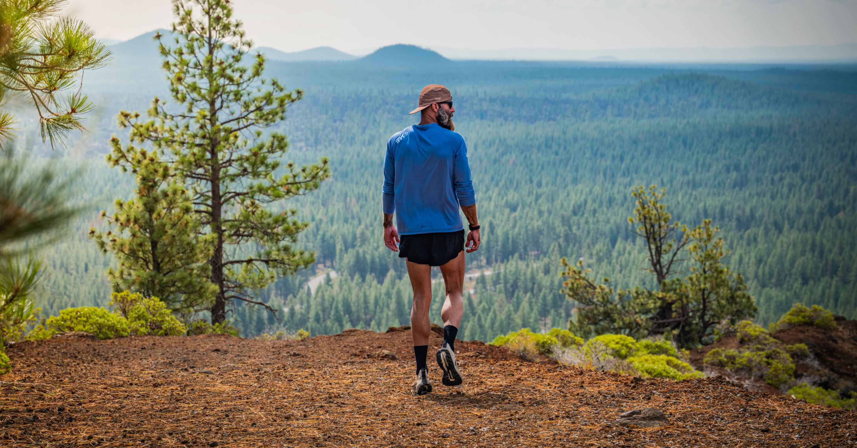 Tommy Rivs takes in sweeping views of Central Oregon's ponderosa pine forest and volcanic peaks during the Oregon season of Rivs Run Club on iFIT.