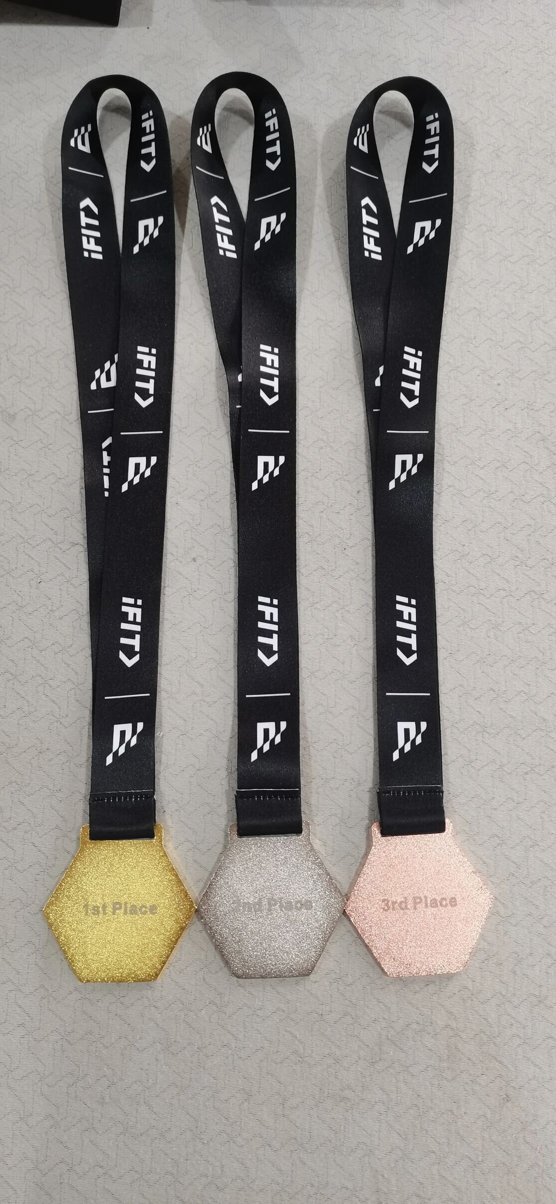 Gold, silver, and bronze medals awarded to Spring Cup winners, recognizing top 3 finishers in each category.