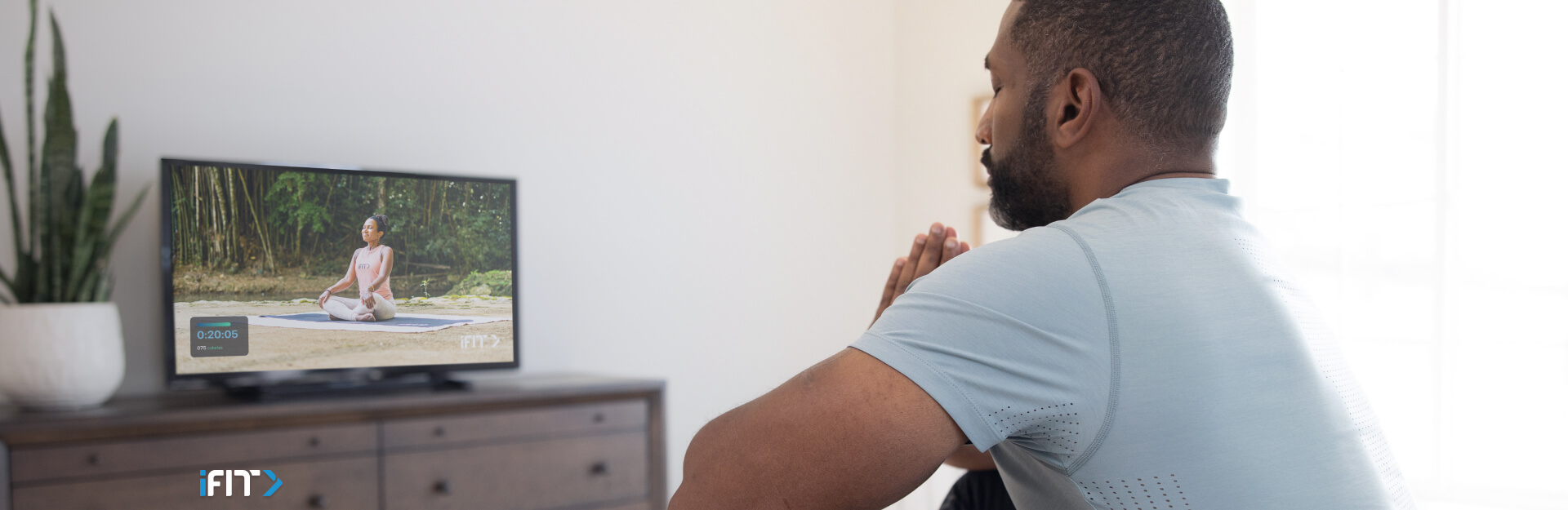 Woman does iFIT mindfulness exercises Woman works out with iFIT mindfulness exercises