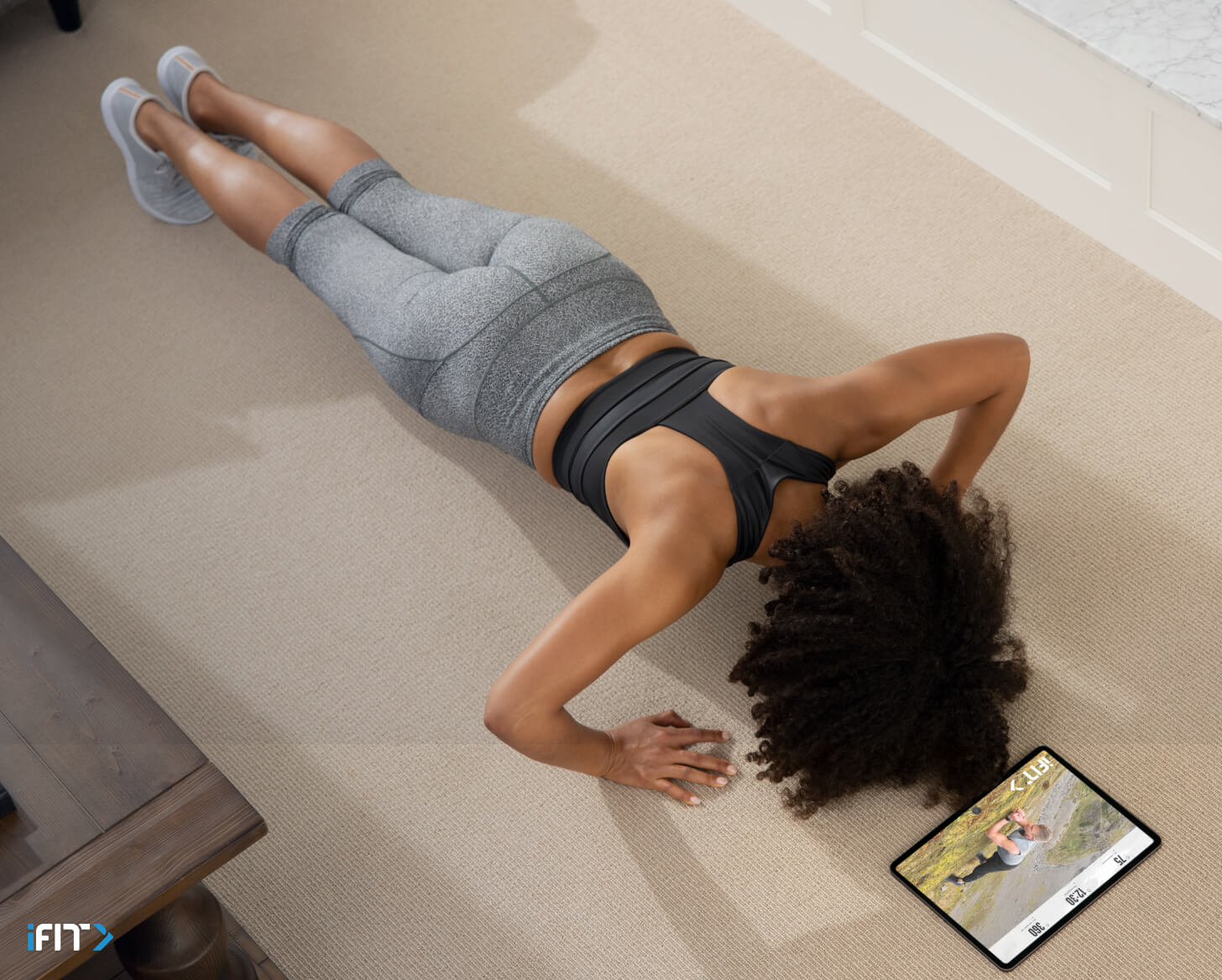 Woman completes an iFIT chest class Woman does an iFIT chest class