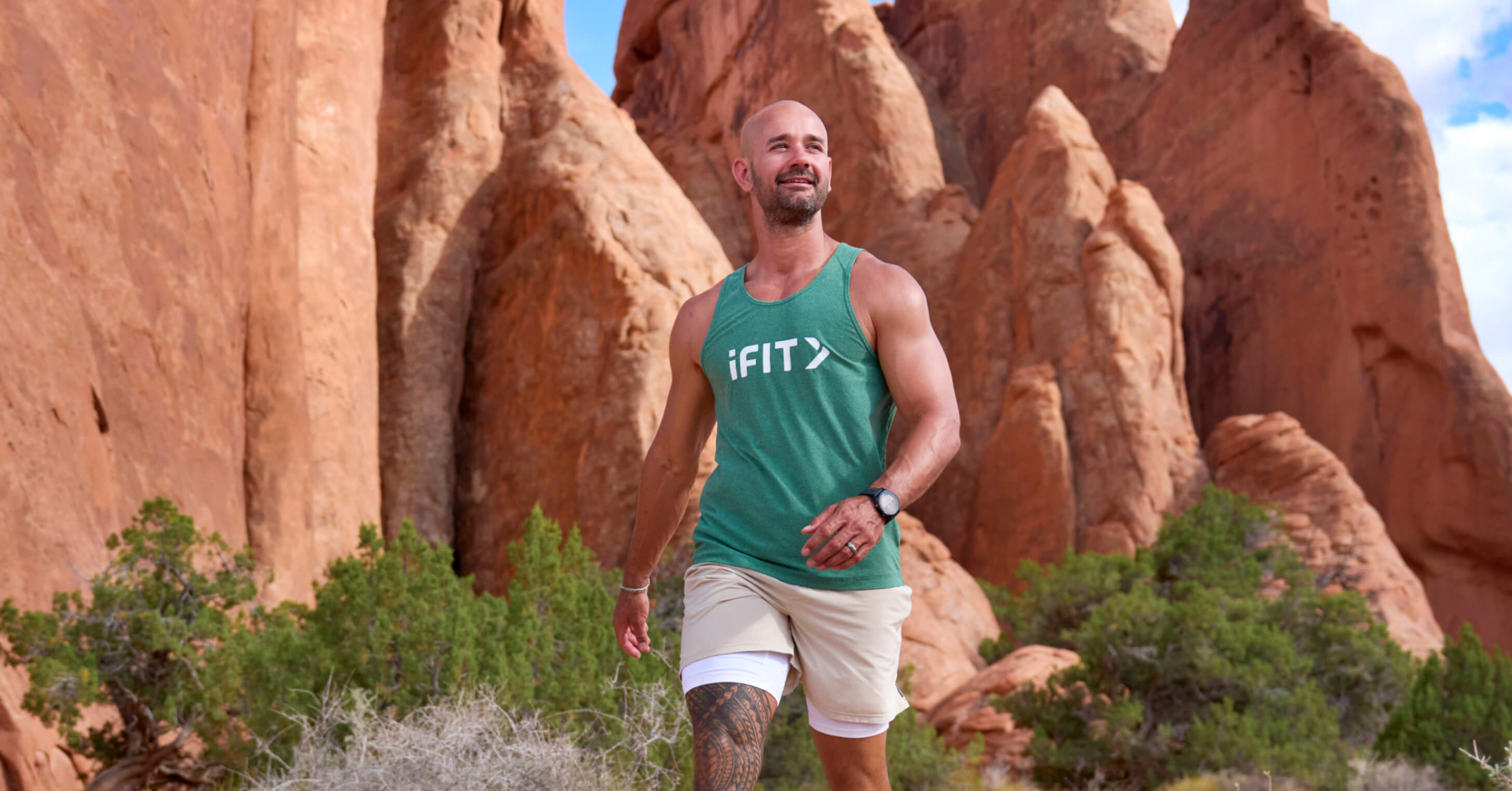 Trainer Paulo Barreto moves through Arches National Park's rock formations on the iFIT app's Cardio Series.