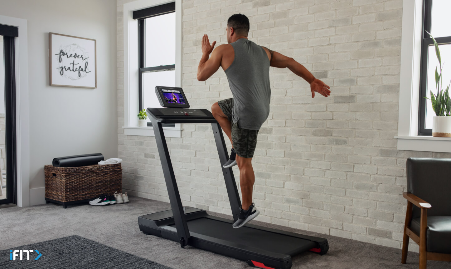 Man completes an iFIT HIIT class Man completes an iFIT HIIT exercise