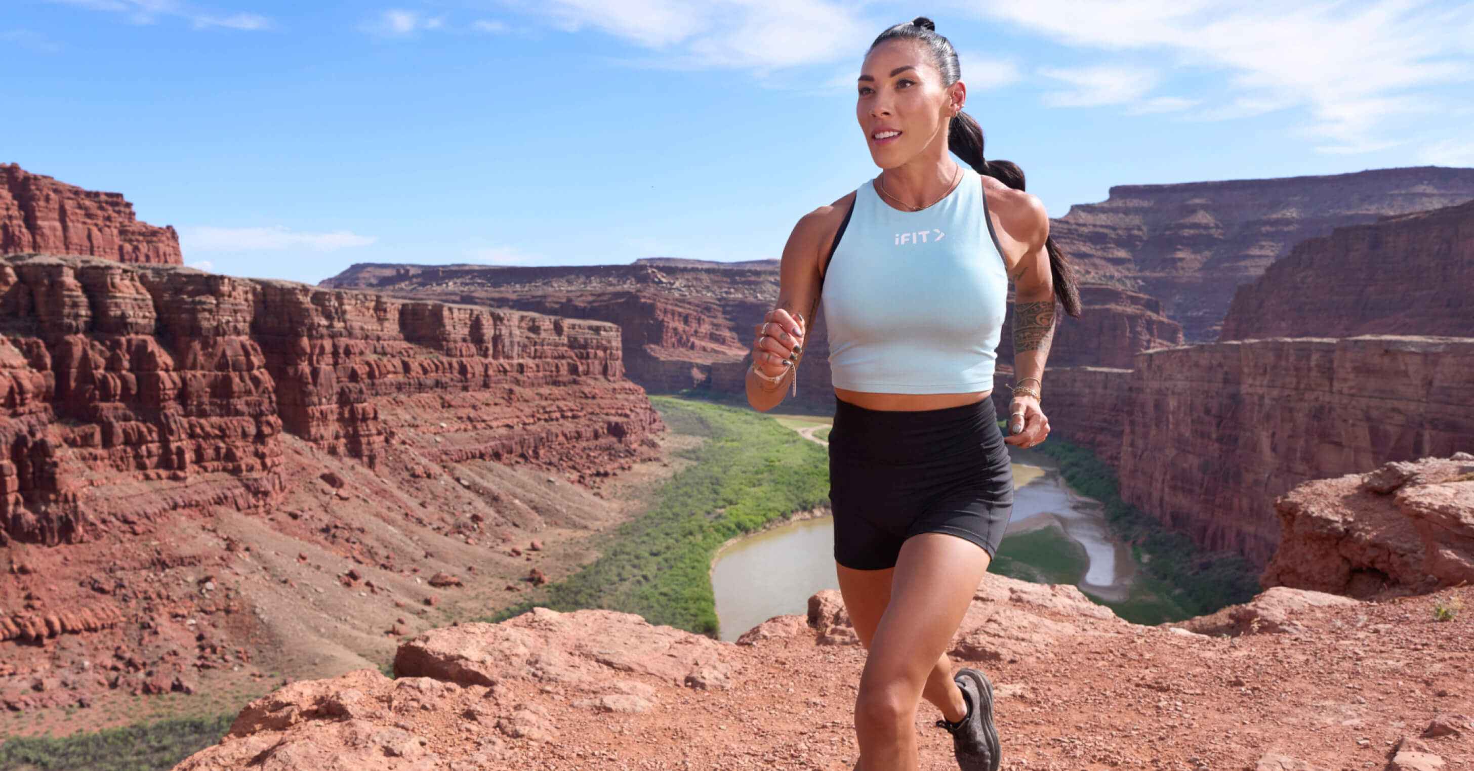 iFIT Trainer Hannah Eden runs the canyon rim trails of Canyonlands National Park in the advanced Canyonlands National Park Cardio Series on iFIT.