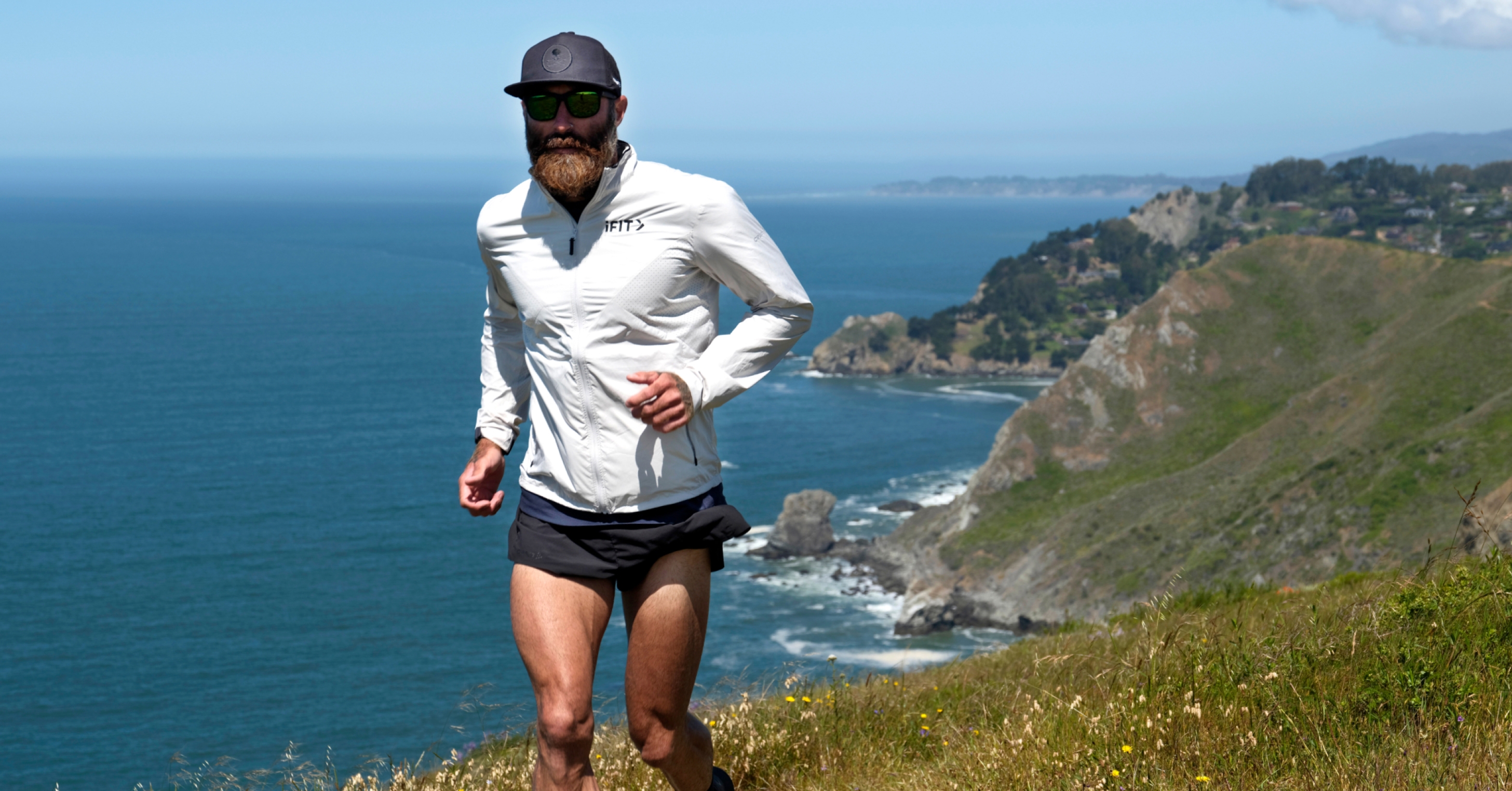 Tommy Rivs leads a scenic coastal running workout as part of the California Coast Light Running Series in the iFIT fitness app.