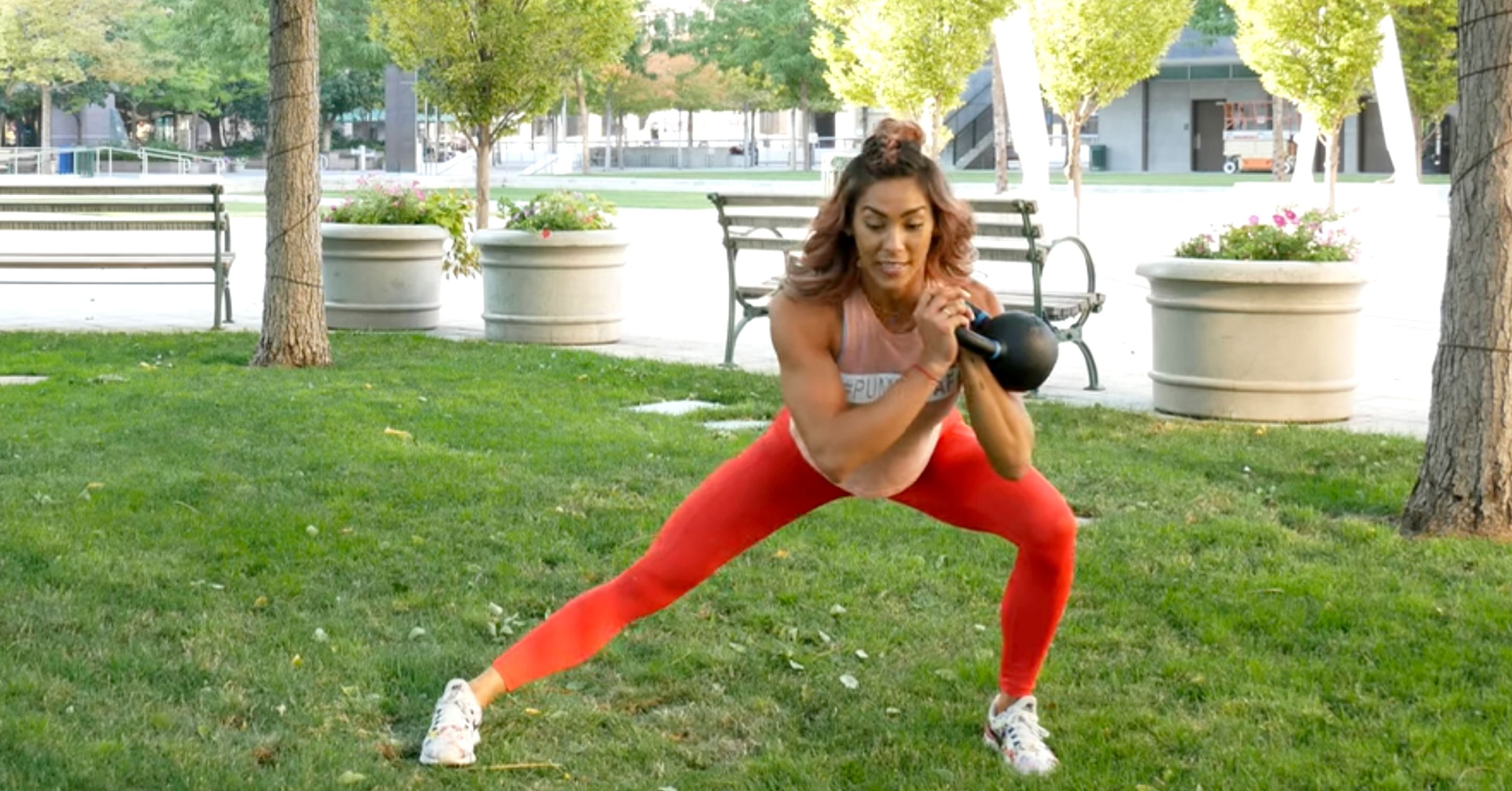 Hannah Eden leads a dynamic kettlebell lunge movement designed to build lower body strength and stability.