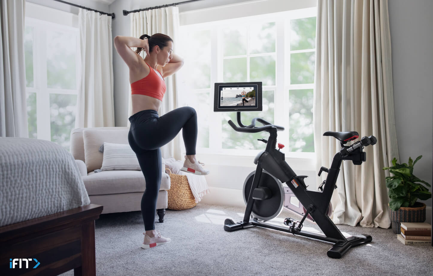 Woman completes an iFIT HIIT exercise Woman completes an iFIT HIIT class