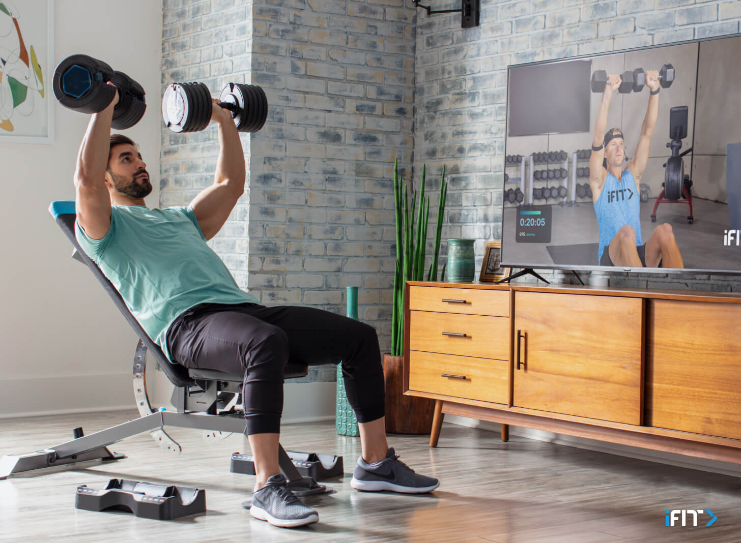 Man completes iFIT chest workouts Man does iFIT chest workouts