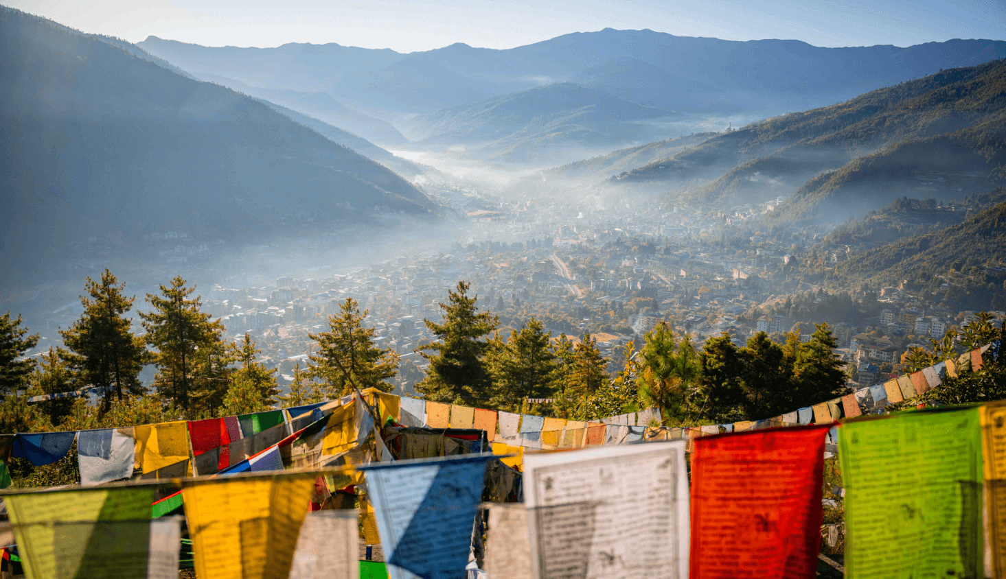 Prayer flags overlook a Bhutanese valley.