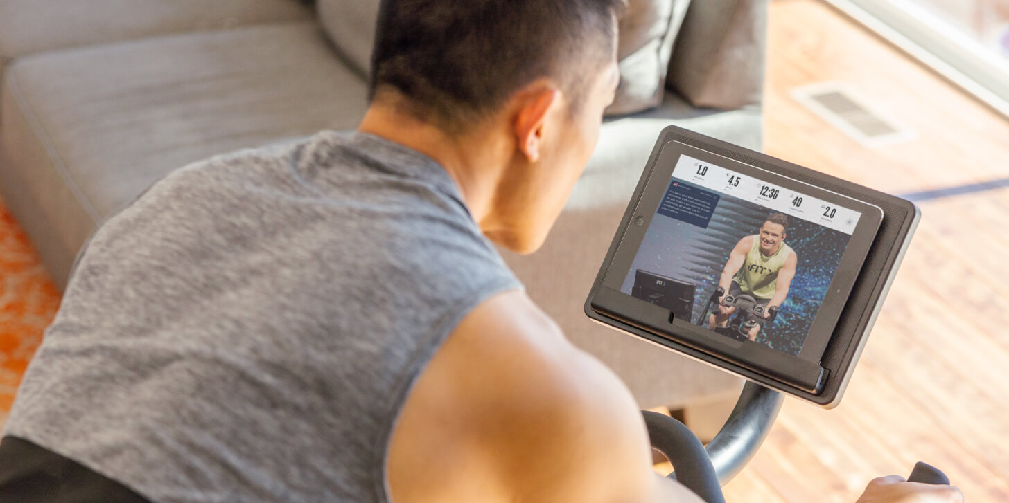 Man does a bike workout using SmartAdjust Man uses SmartAdjust during a bike workout