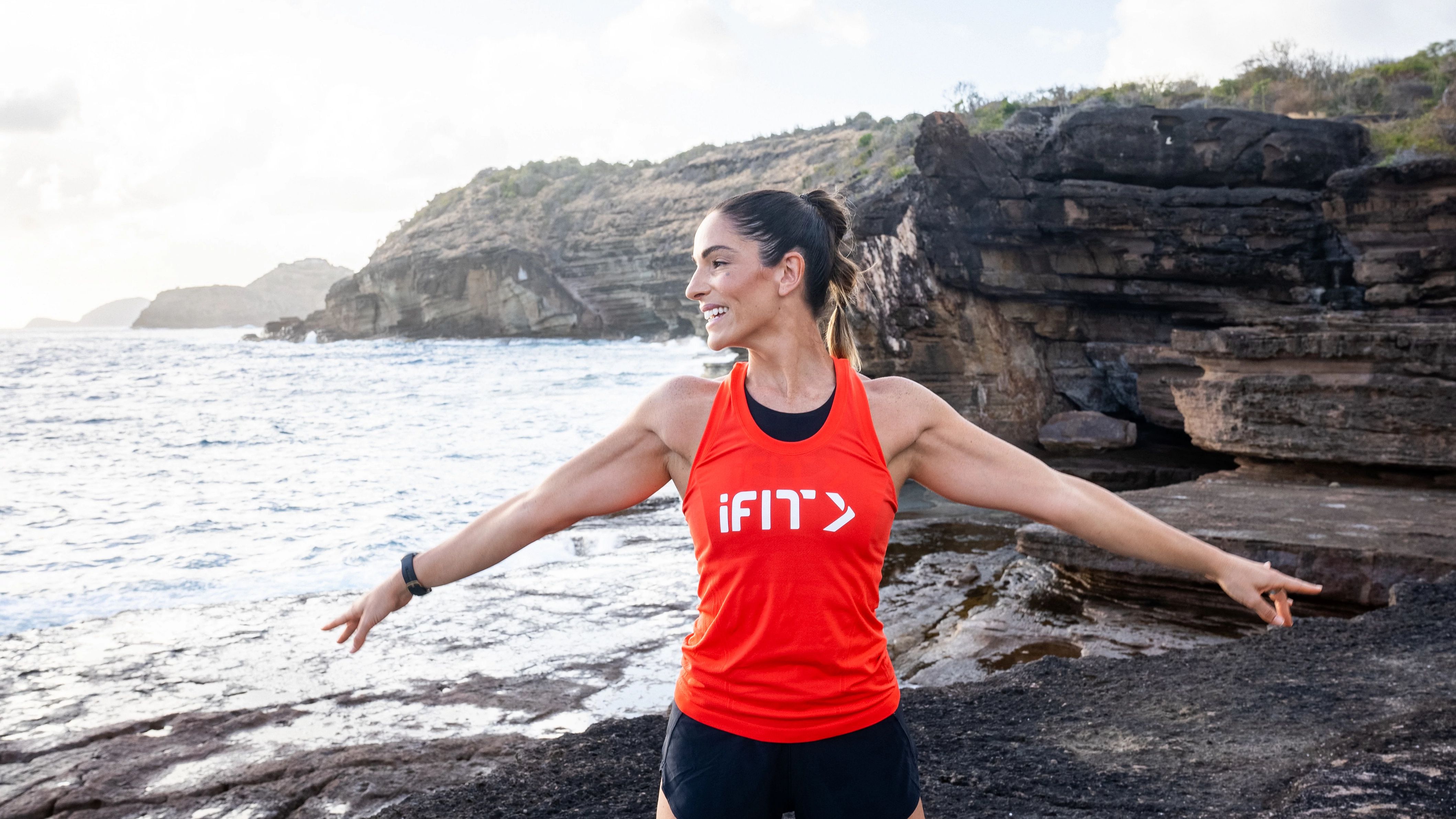 iFIT Trainer Jeni DelPozo takes in the coastal views of Antigua in her Restorative Pilates mat series.