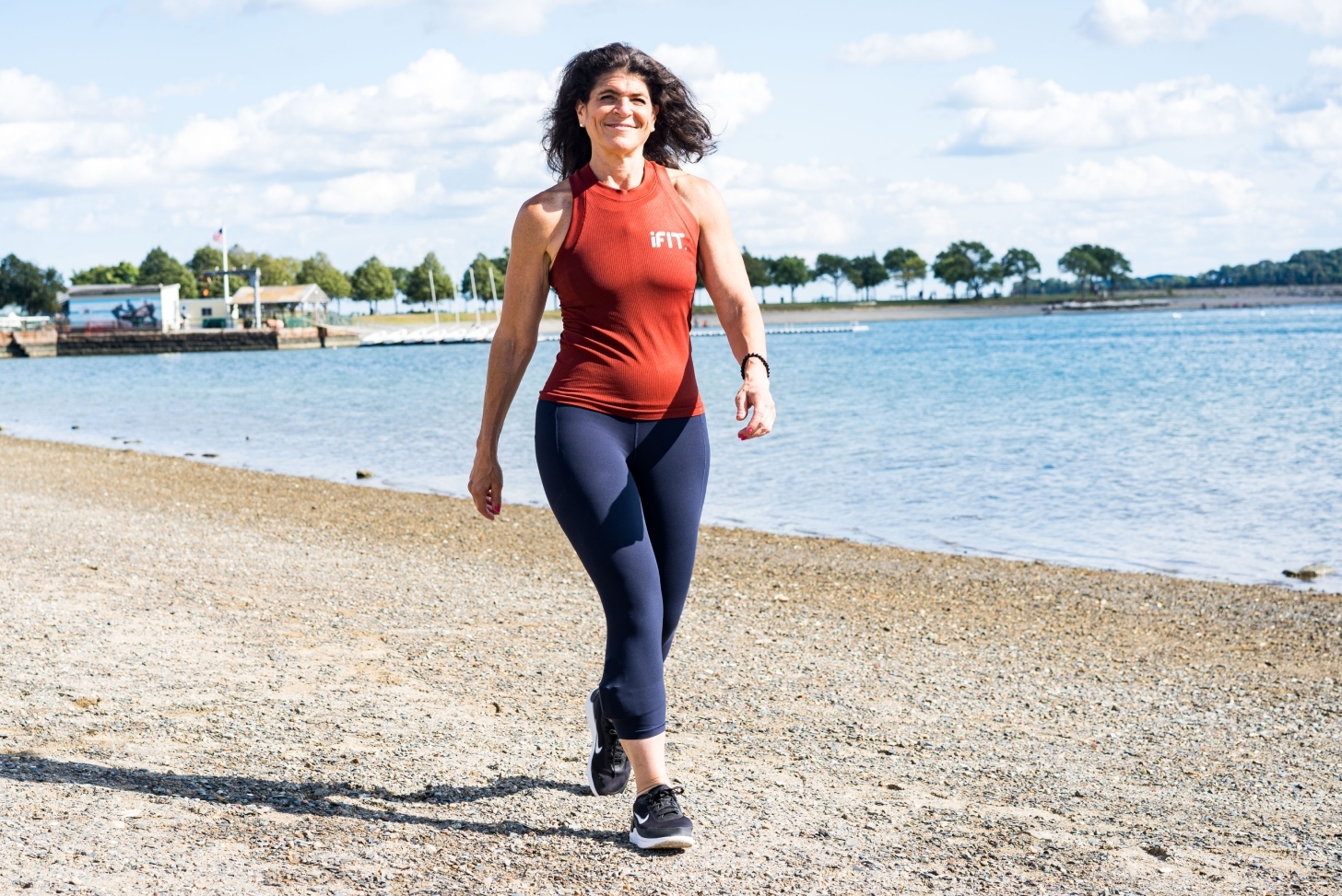 iFIT Guide Dr. Eva Selhub coaches a walking class on the beach iFIT Guide Dr. Eva Selhub coaches a walking workout on the beach